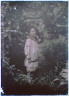 Arnold Genthe / Boy, possibly a son of Morley Kennerley, standing in a garden / between 1906 and 1942