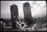 Gilles Peress / Untitled (view of two skyscrapers through broken window) / 1993