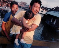 A Man and Children on a Bridge, Banjarmasin, South Borneo, from the portfolio Map of the East