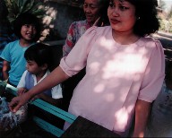A Woman and Children at a Hawker's Cart, Bandung, West Java, Indonesia, from the portfolio Map of the East