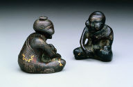 [One of a] pair of mat weights in human form