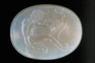 Scaraboid intaglio with kneeling youth drawing a bow