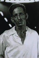 The human pincushion at a carnival in his silk shirt, N.J., 1961