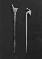 Two ivory pins