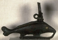 Statuette of sacred fish with glass eye, wearing Hathor's headdress