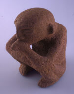 Figurine holding flute