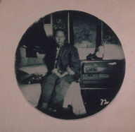 Chinatown Album: Man Sitting on a Bed