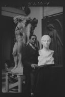 Patigian, Haig, Mr., with his sculptures, portrait photograph