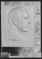 Portrait relief sculpture of Henry Miller