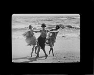 Three dancers on the beach