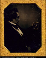 Young Man Looking at a Daguerreotype