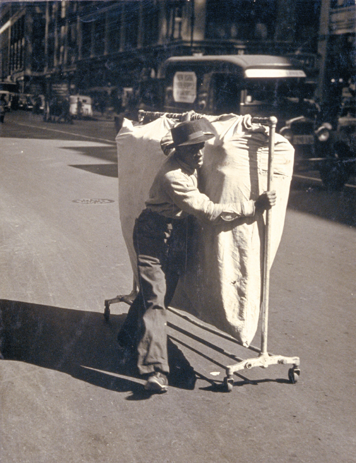 Man pushing garmet rack - The AMICA Library
